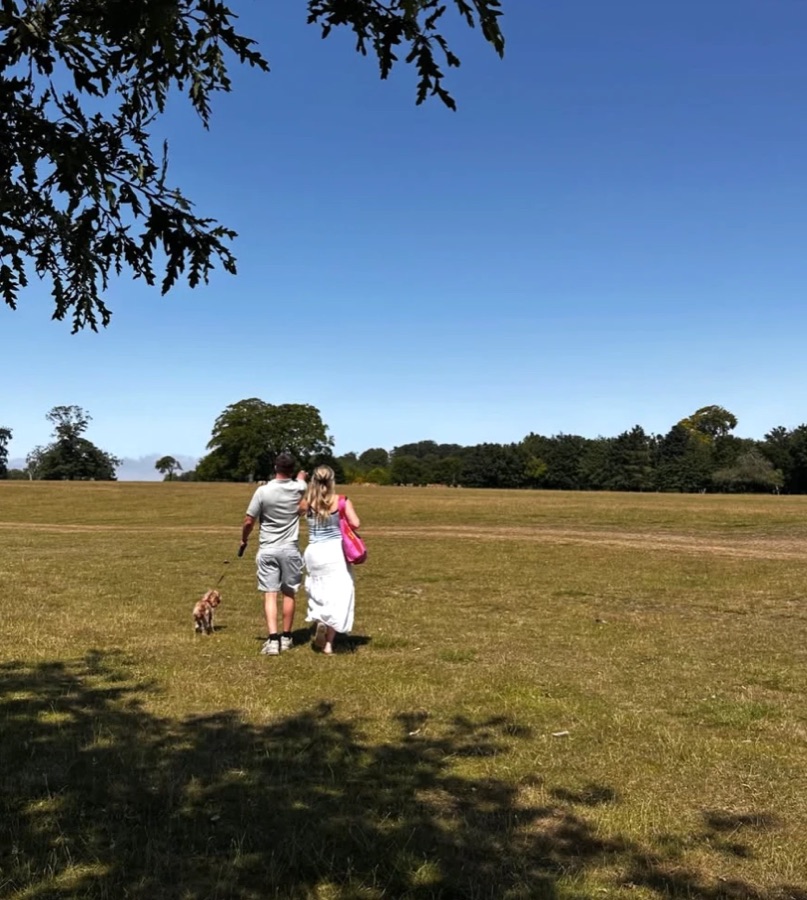 Matthew and Romany walking with their dog